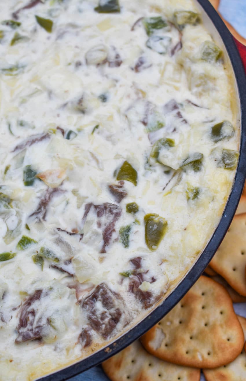 philly cheesesteak dip in a cast iron skillet