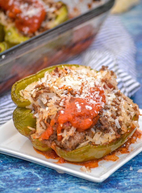 saucy Italian style stuffed pepper served on a small white plate