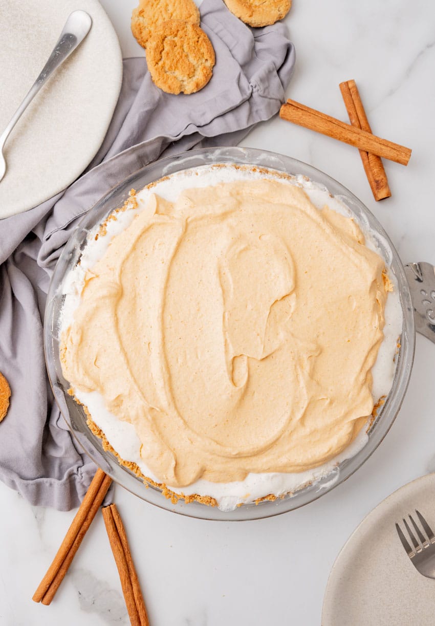 a pumpkin ice cream pie on a white countertop