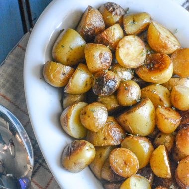 crispy salt and vinegar potatoes in a white serving platter
