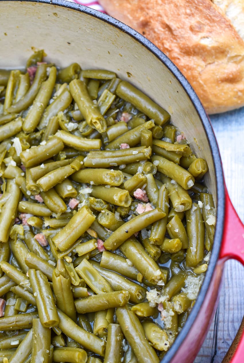 grandma's canned green beans recipe in a red dutch oven