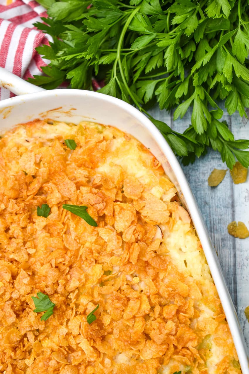 rotisserie chicken and rice casserole in a white baking dish