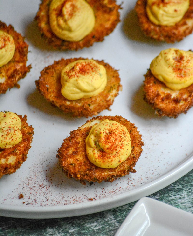 FRIED DEVILED EGGS ON A LARGE WHITE PLATE