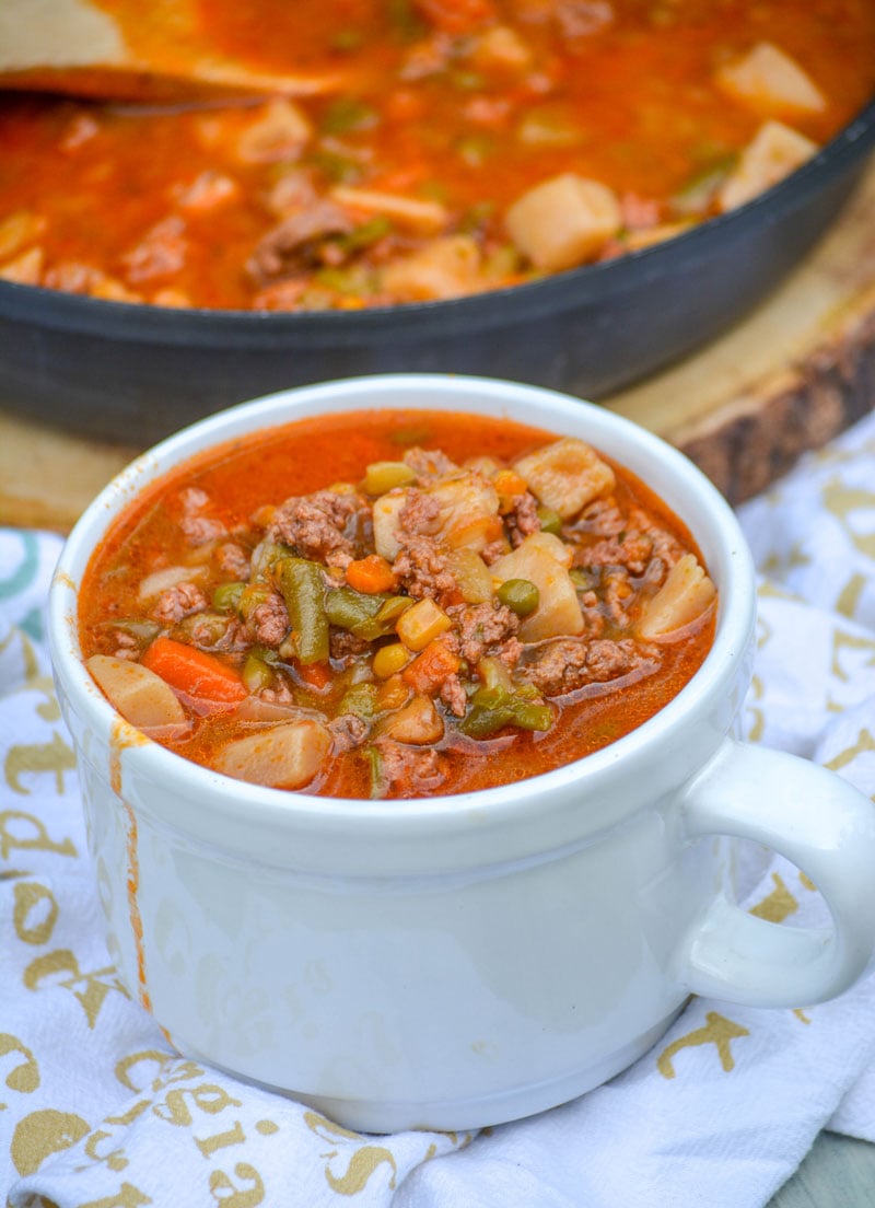 campfire beef stew in a white mug