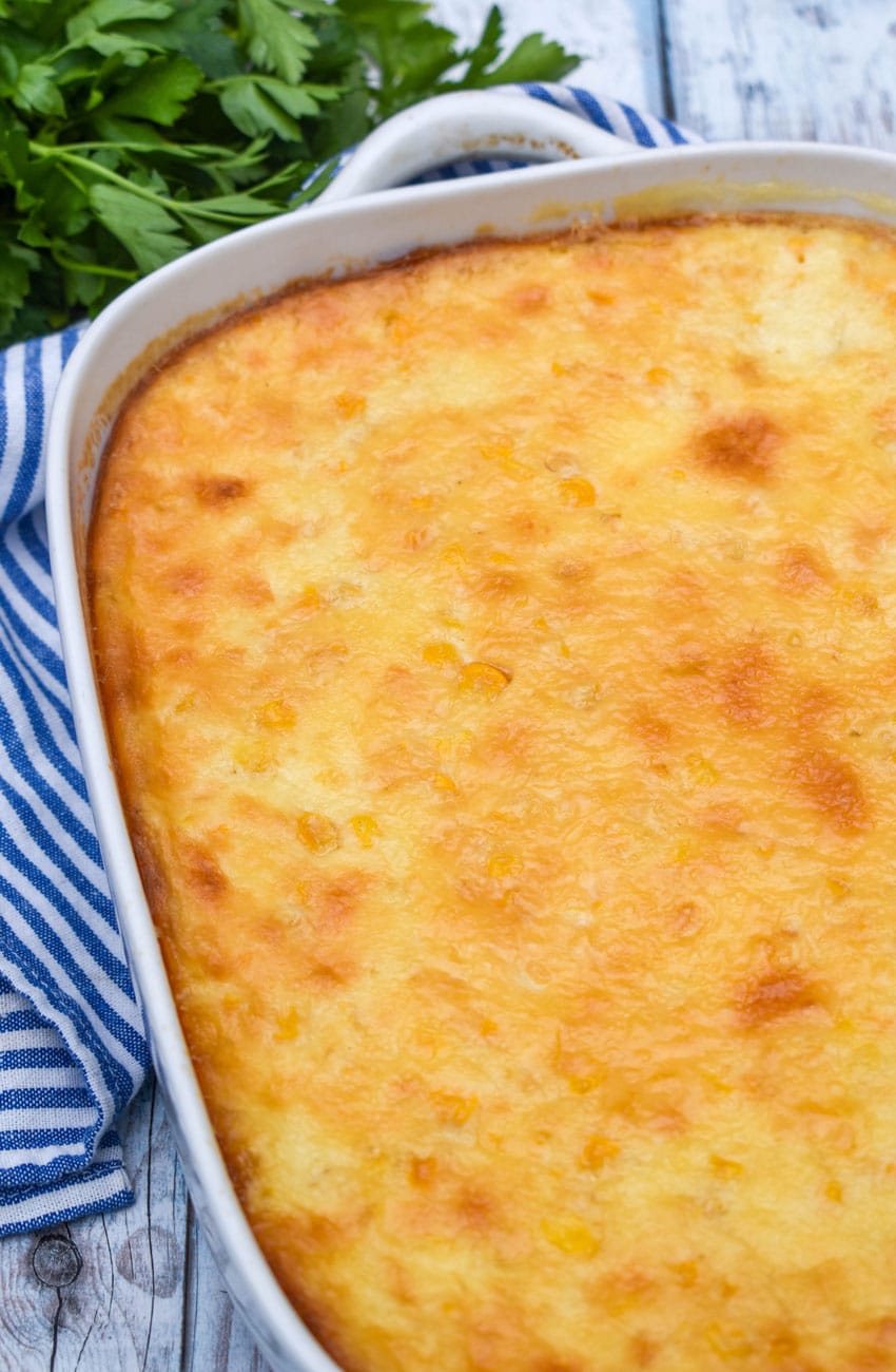 Southern creamed corn pudding recipe in a white baking dish