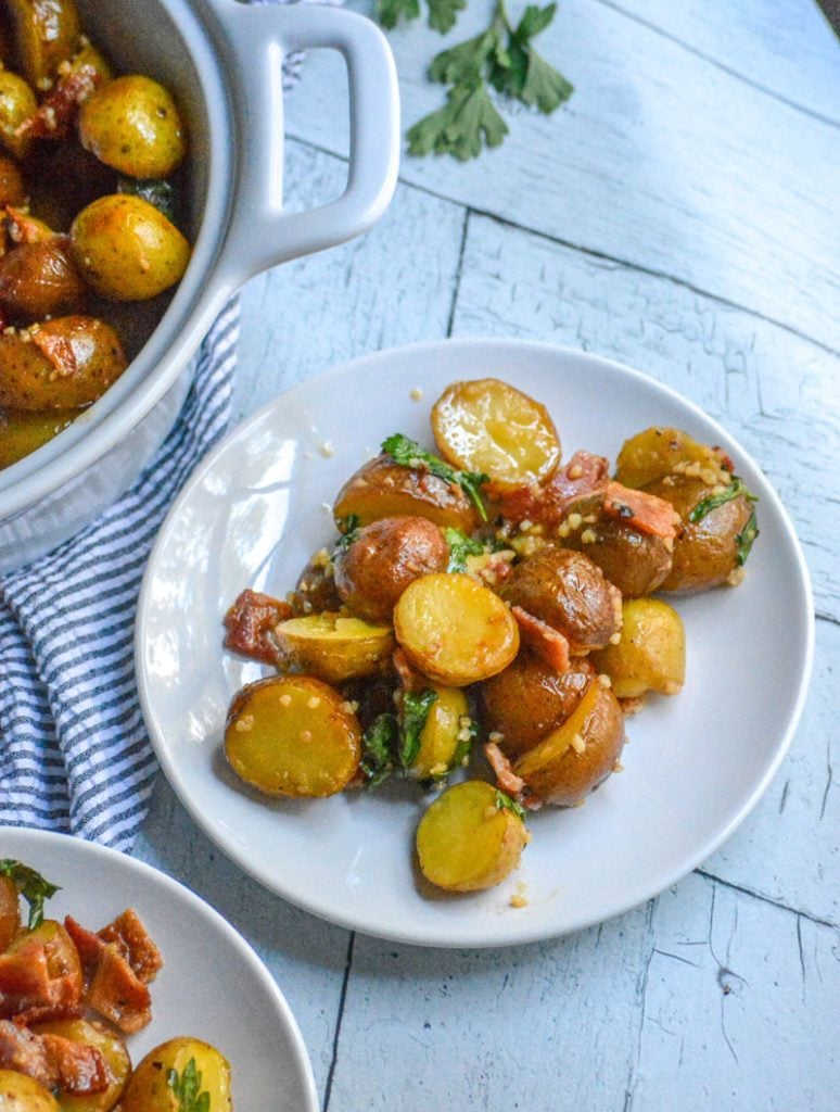 still warm roasted potatoes, bacon, & Italian parsley are tossed in a tangy homemade garlic honey mustard dressing making a simple, delicious potato salad