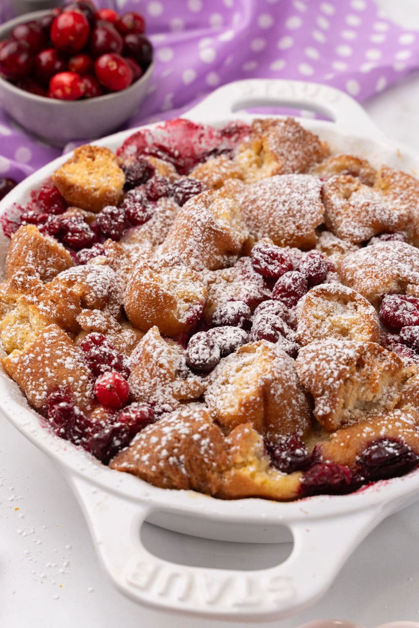 cranberry bread pudding with donuts in a white pie dish