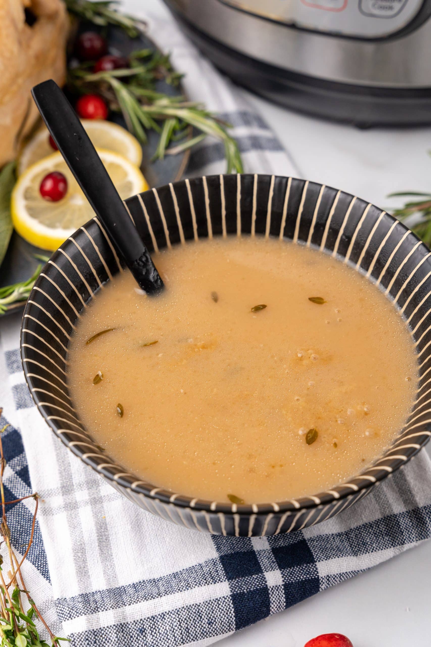 instant pot turkey gravy with herbs in a bowl