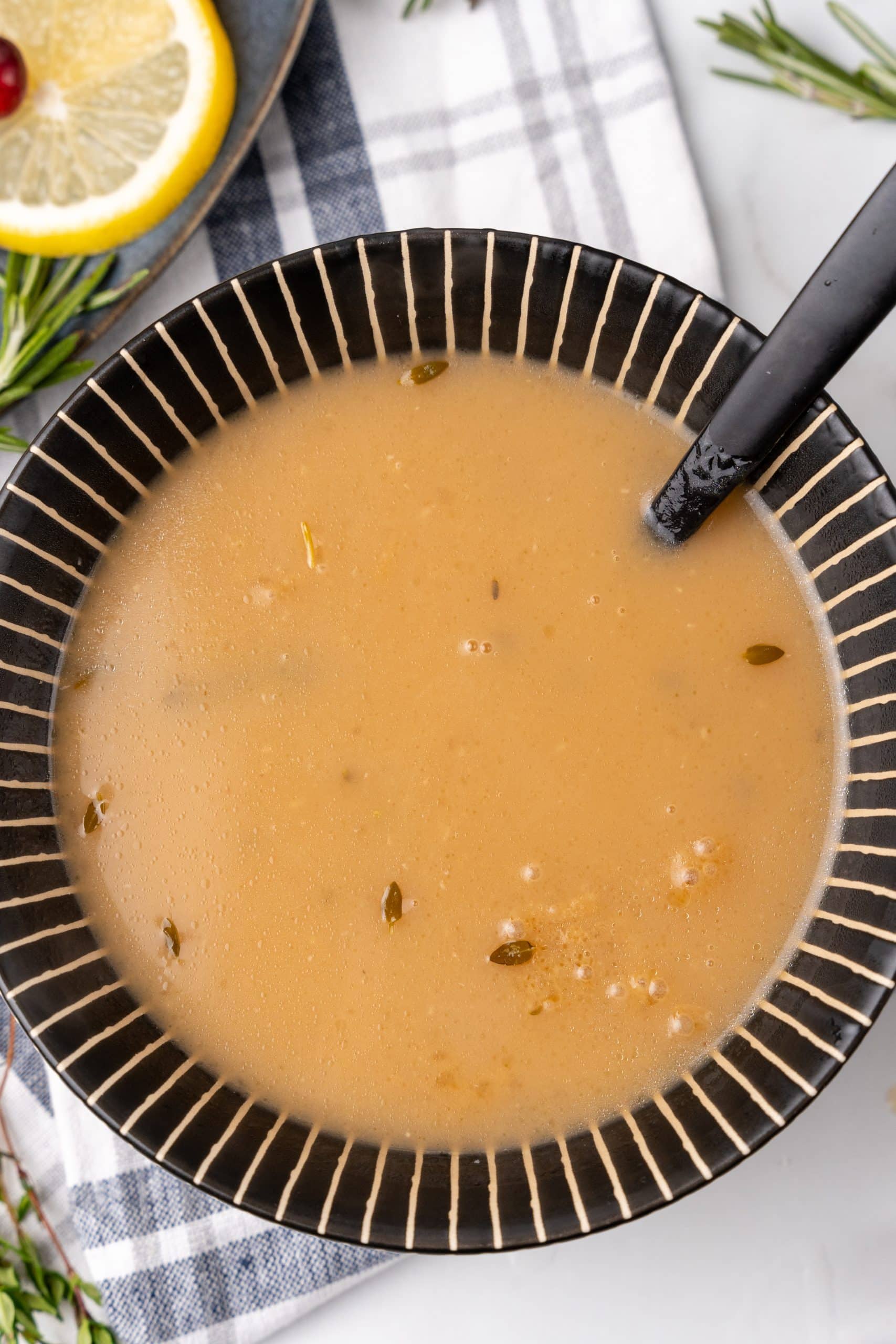 instant pot turkey gravy with herbs in a bowl