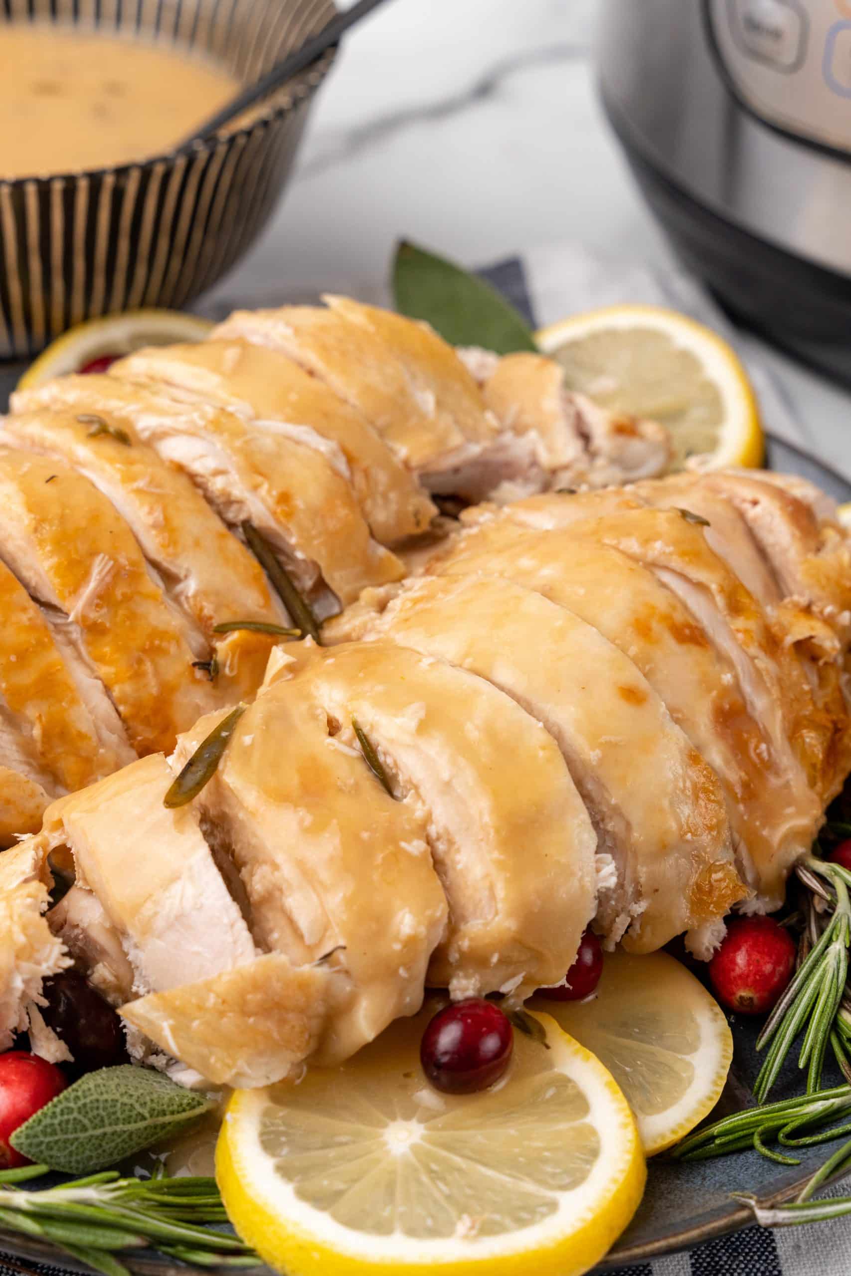 gravy covered sliced turkey breast on a serving platter