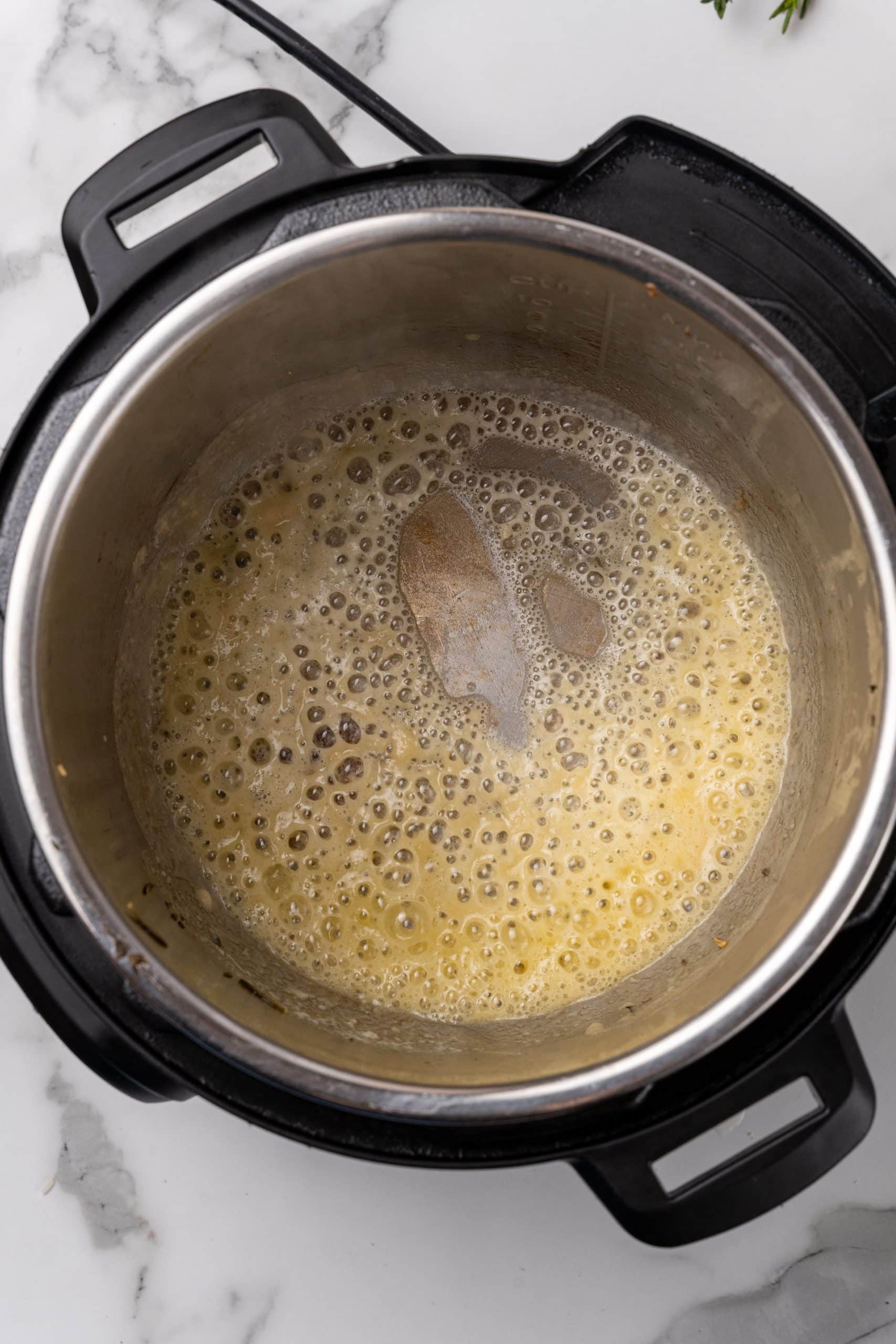 sauteed butter in the bowl of an instant pot