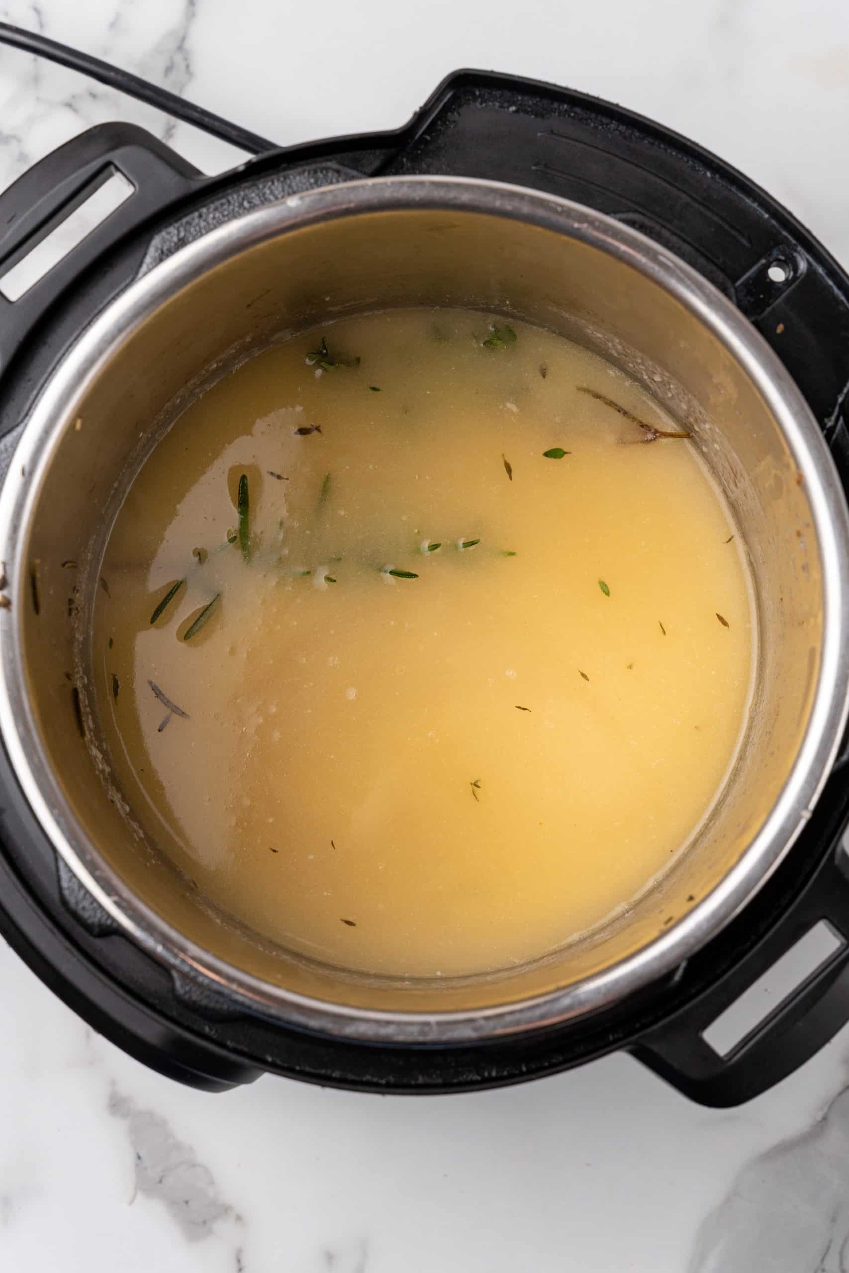 herbed turkey gravy in the bowl of an instant pot