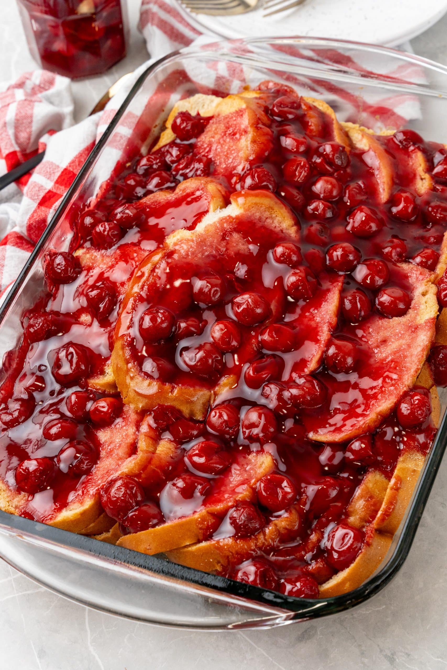 overnight cherry french toast bake in a 9x13 inch glass baking dish