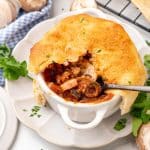 a silver fork scooping pizza pot pie out of a small white ramekin