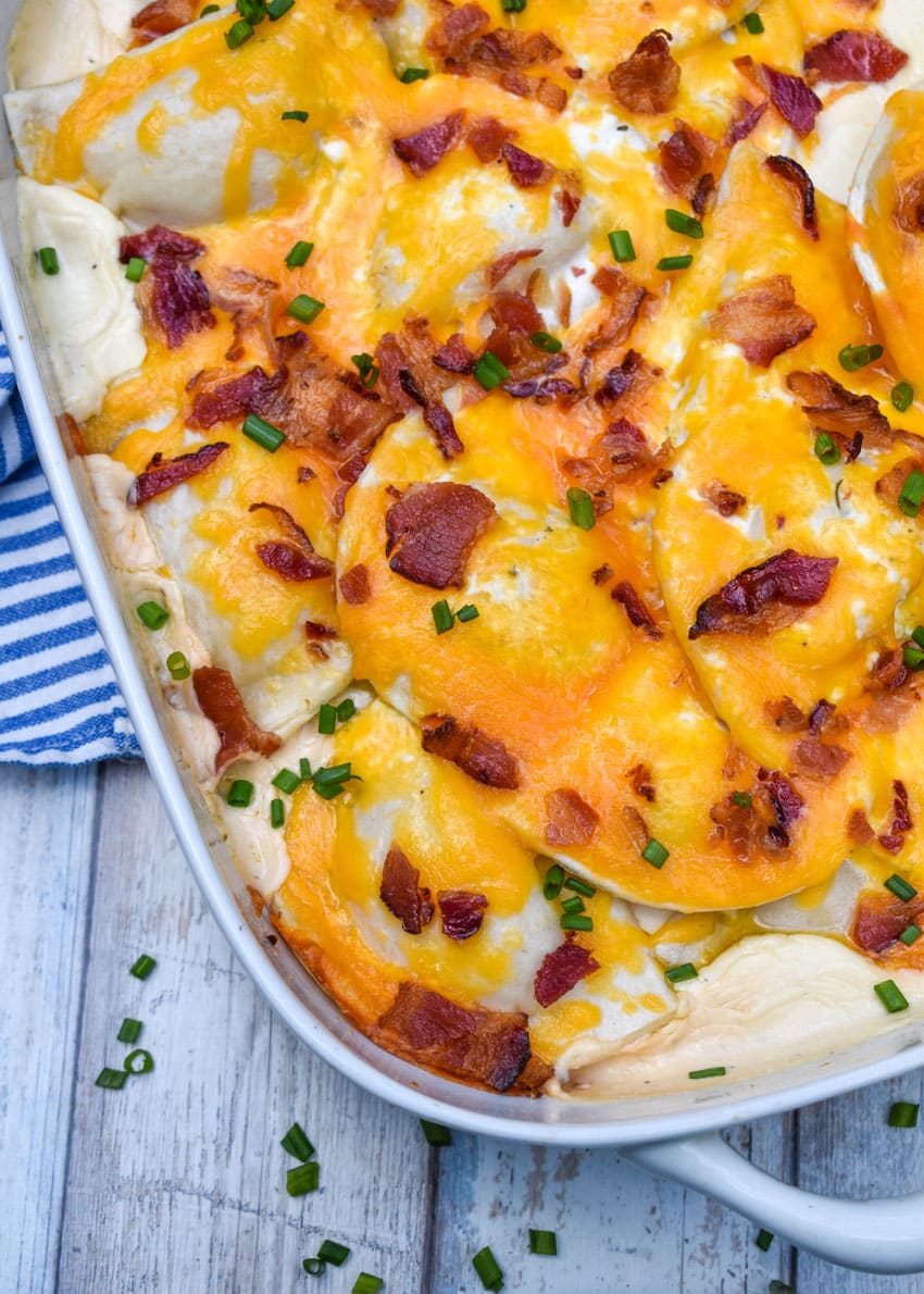 cheddar bacon ranch pierogi bake in a white casserole dish