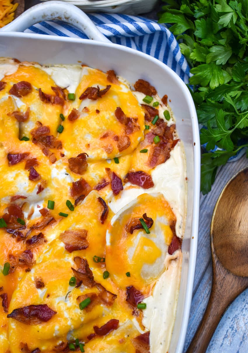 cheddar bacon ranch pierogi bake in a white casserole dish