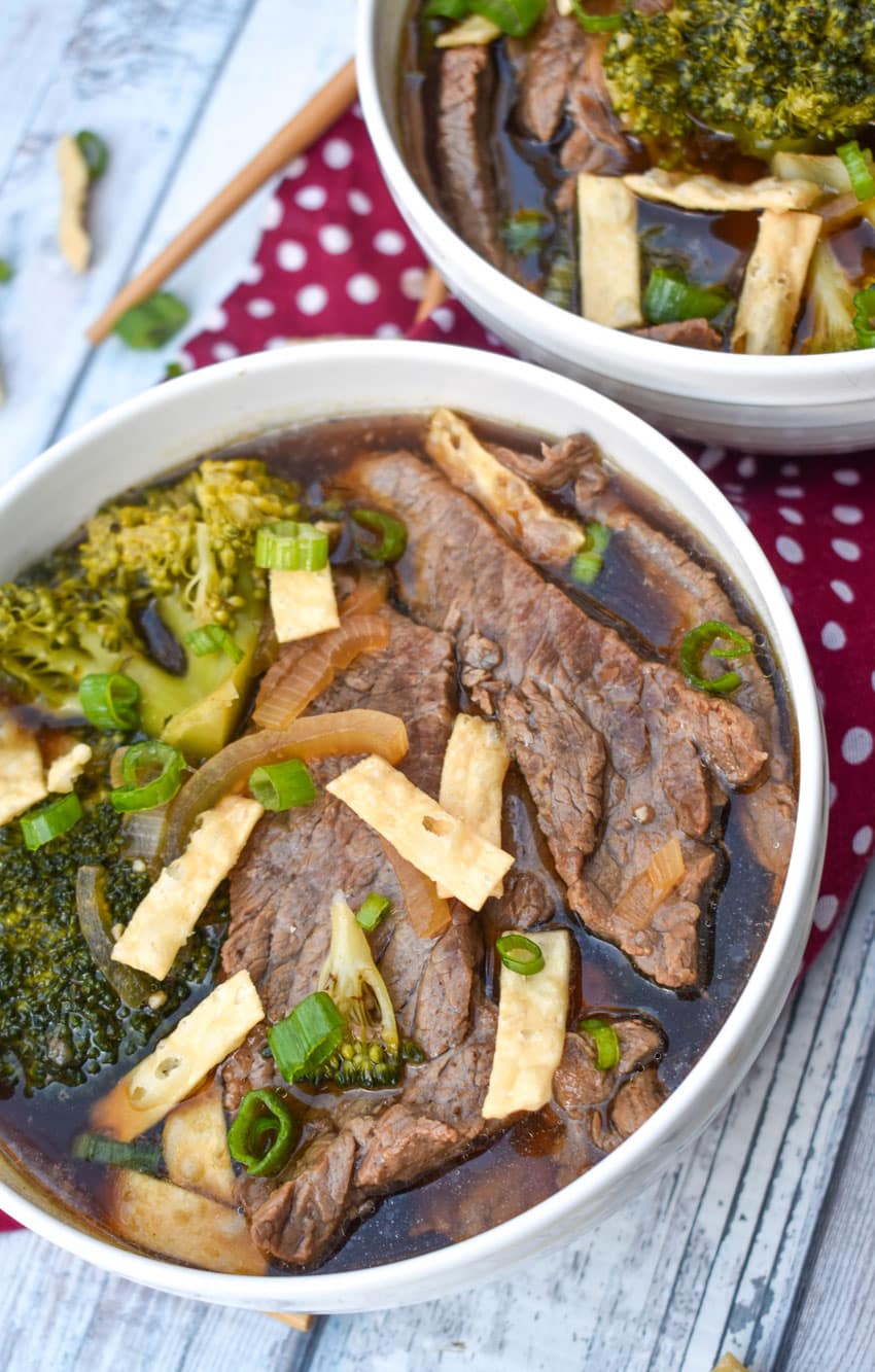chinese beef and broccoli soup in two white bowls