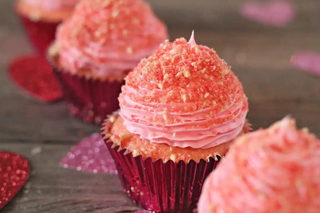 strawberry crunch cupcakes on a wooden table