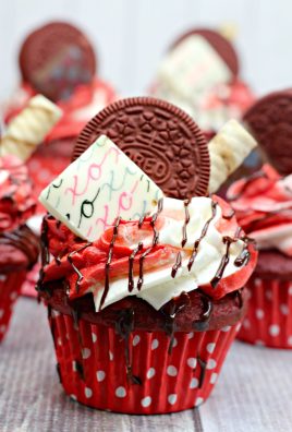 ULTIMATE RED VELVET SWEETHEART CUPCAKES ON A WOODEN TABLE