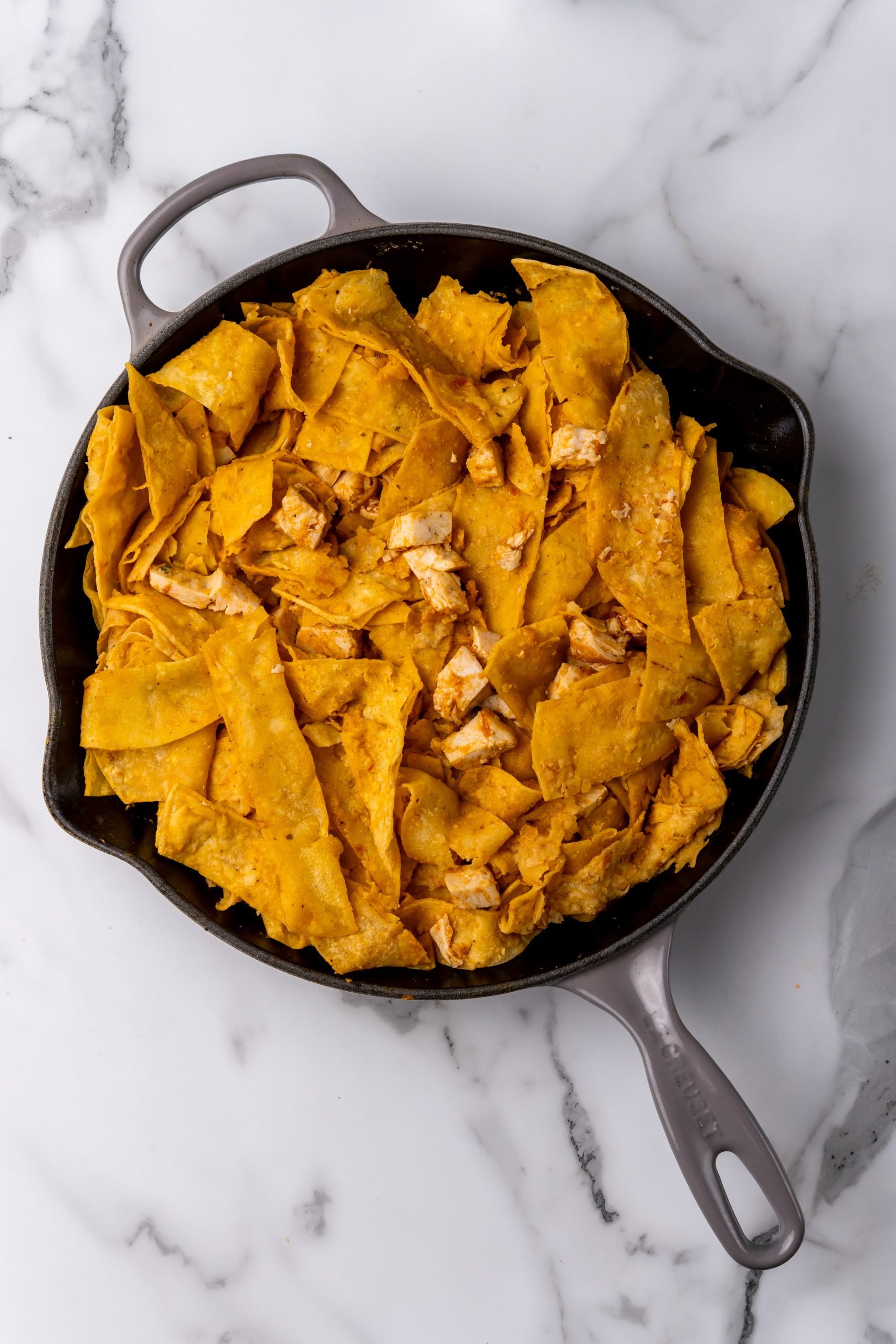 easy chicken chilaquiles in a black skillet