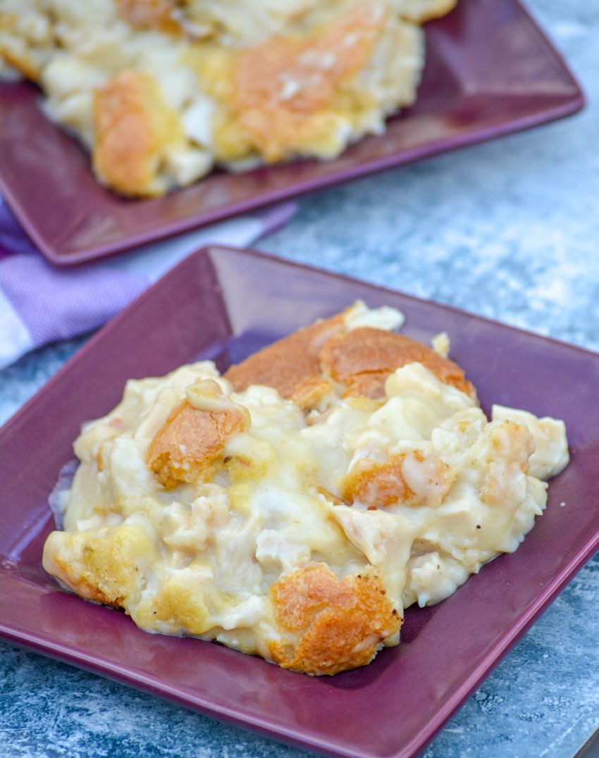 chicken and dumpling casserole on two small square purple plates