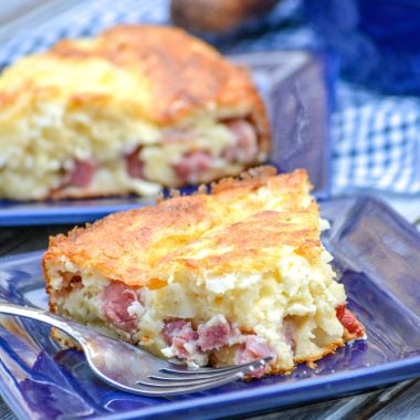 slices of ham & swiss pie on small blue square plates