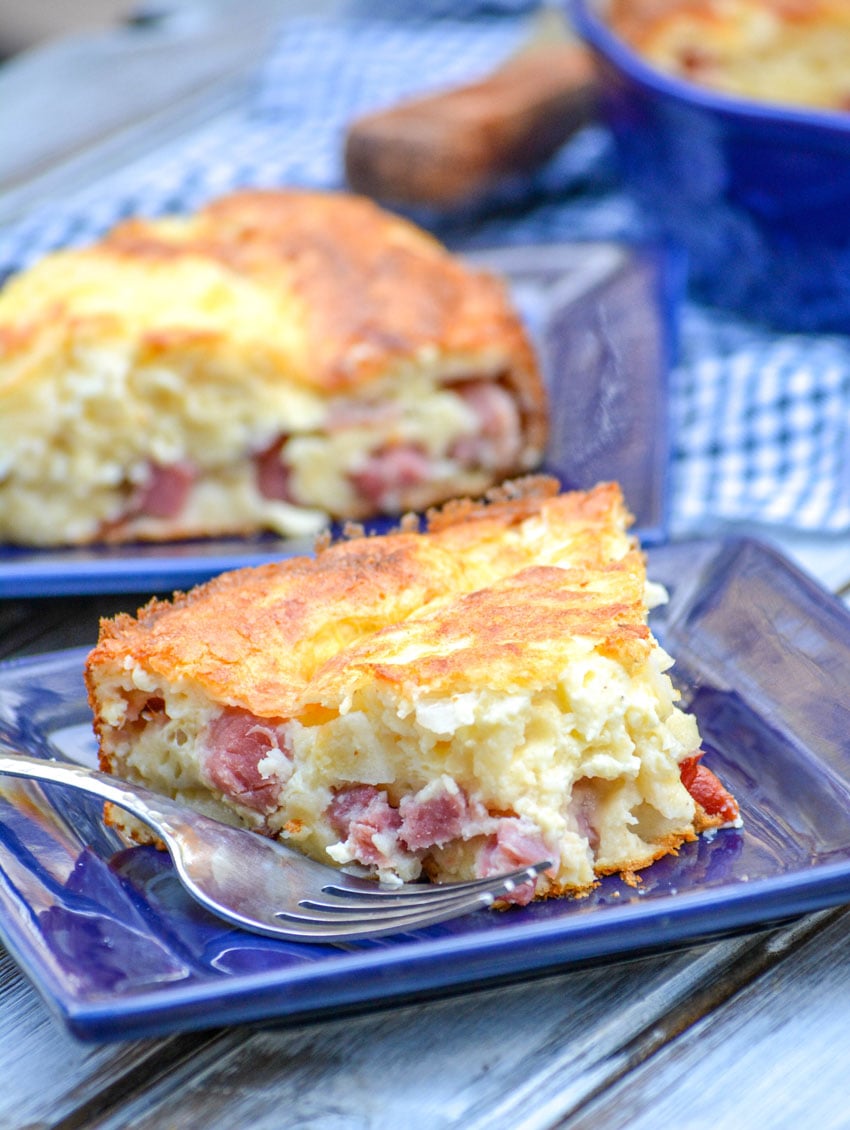 slices of ham & swiss pie on small blue square plates