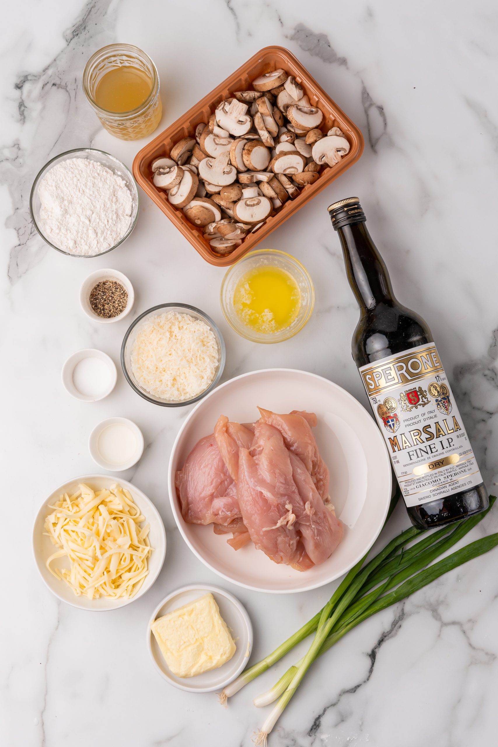 an overhead image showing the measured ingredients needed to make a batch of classic chicken lombardy