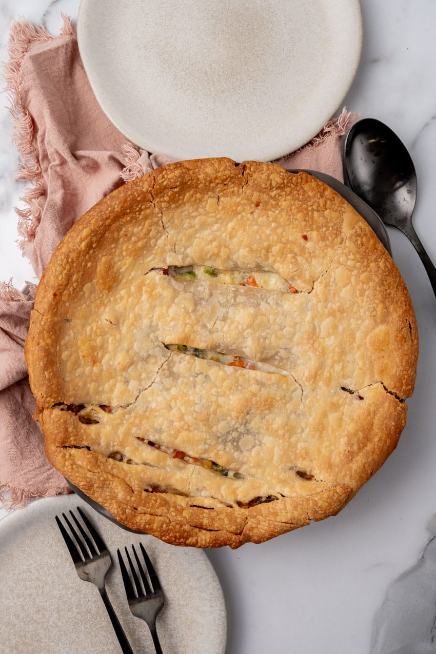 baked ham cobbler with vegetables on a marble counter