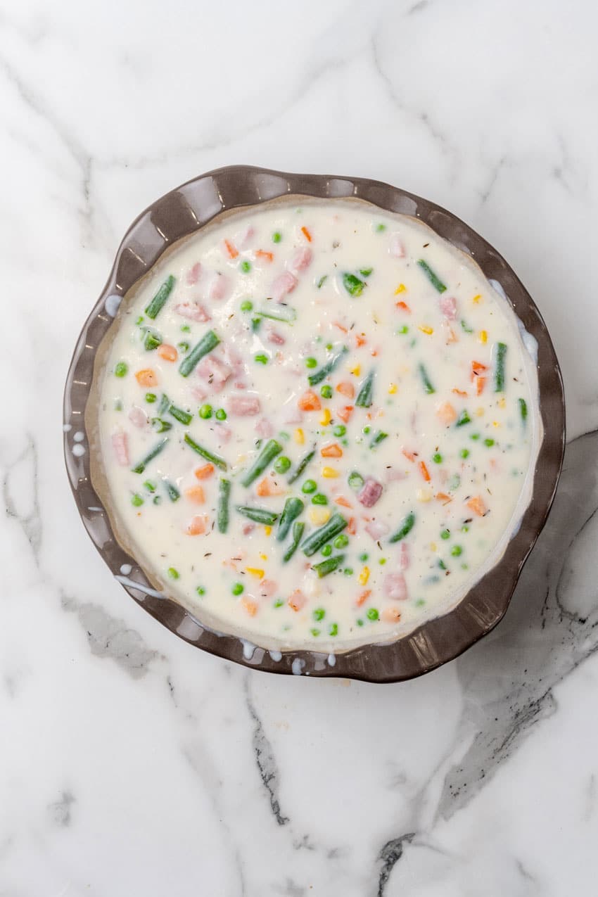 ham cobbler filling in a gray pie plate