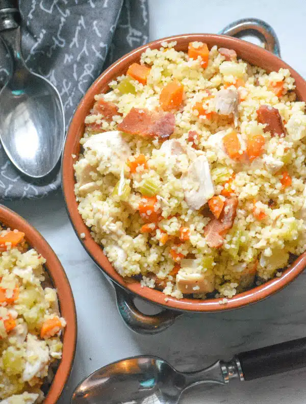 ONE POT CHICKEN BACON COUSCOUS IN TWO SMALL CERAMIC BOWLS