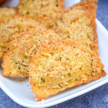 OVEN BAKED TOASTED RAVIOLI ON A WHITE SERVING PLATTER