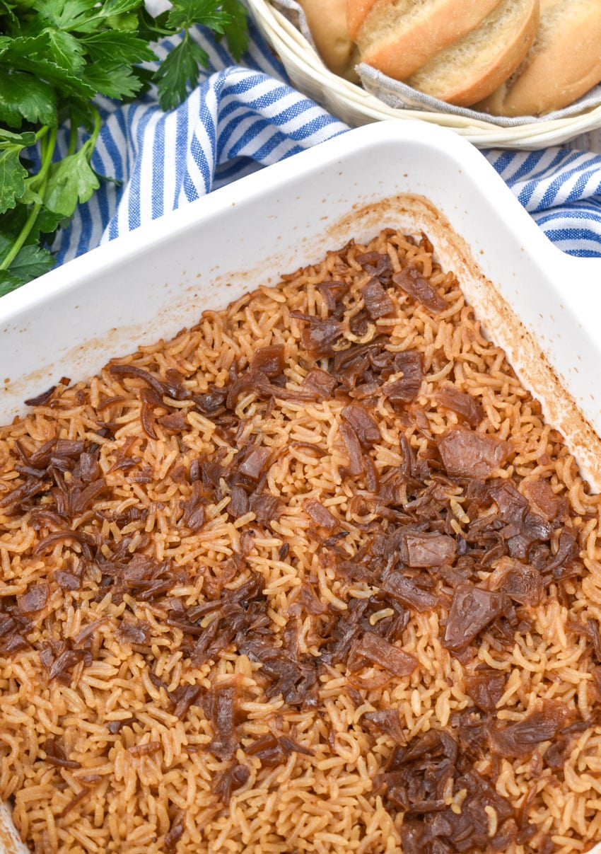 stick of butter rice in a white baking dish