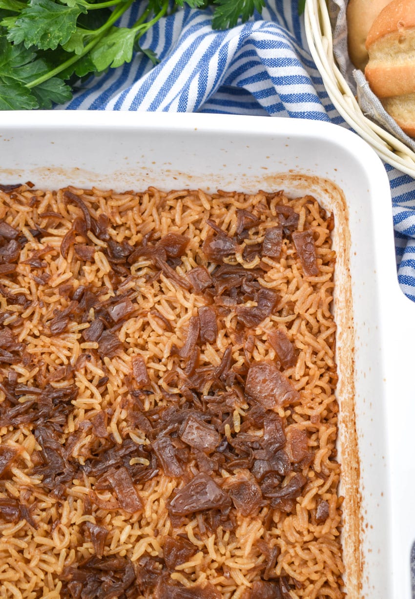 stick of butter rice in a white baking dish