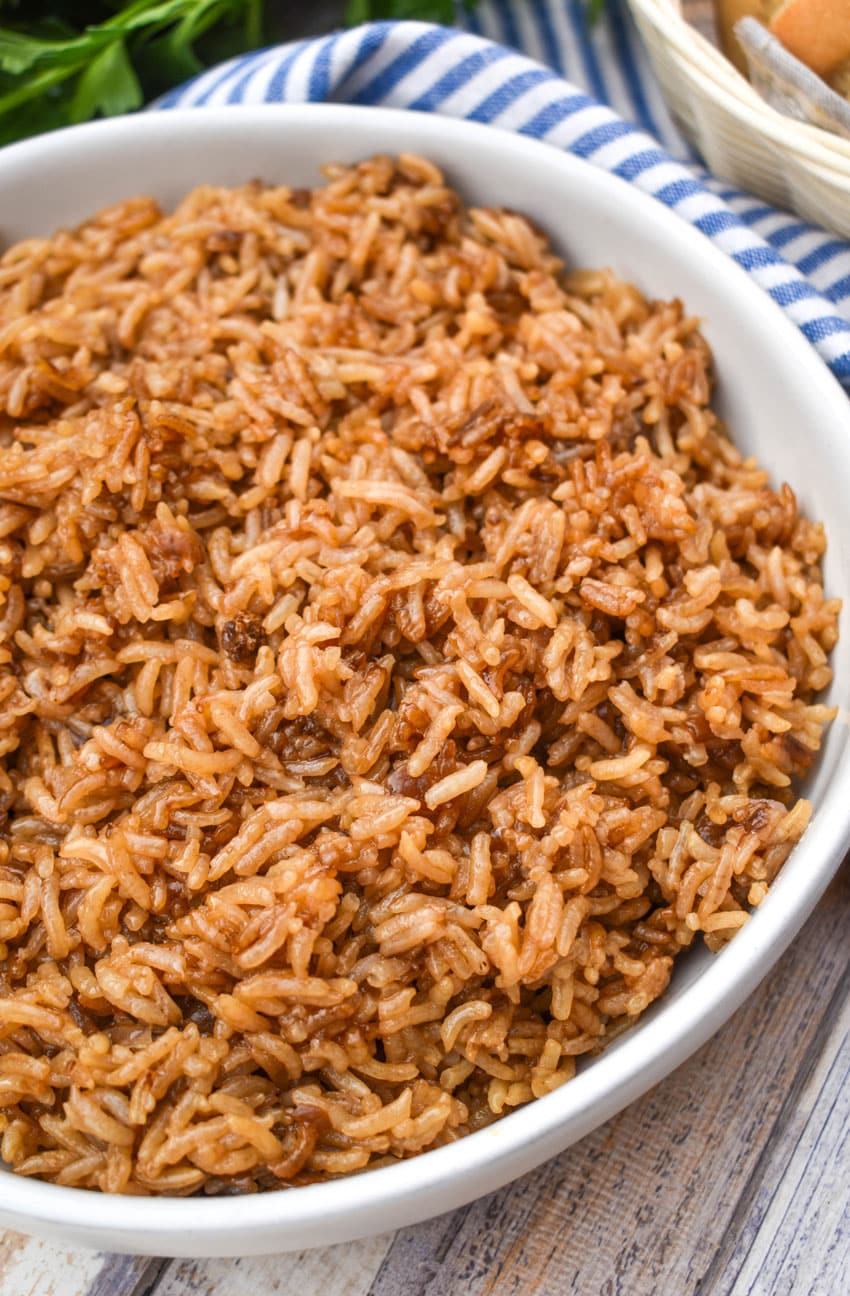 stick of butter rice in a large white serving bowl