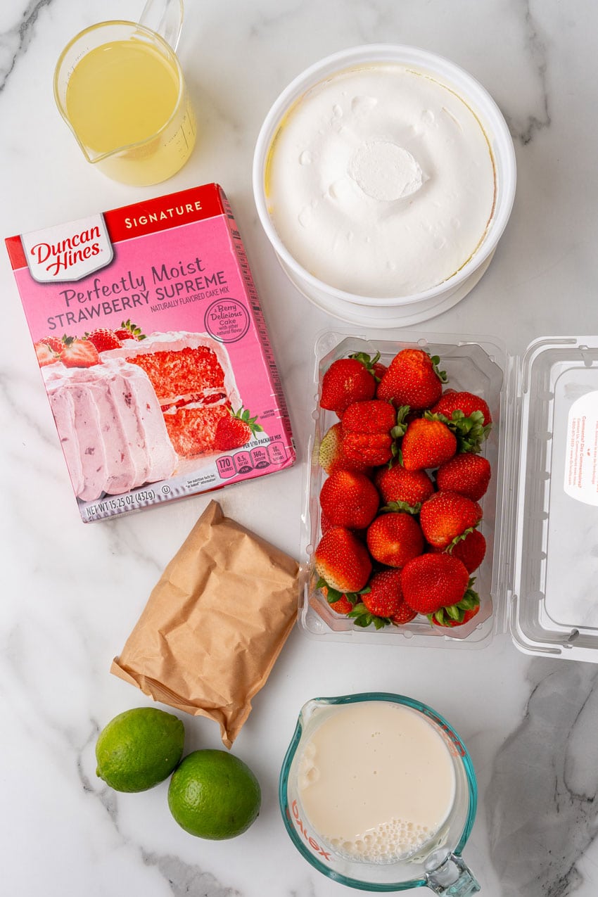 an overhead image showing the measured ingredients needed to make an easy strawberry margarita poke cake