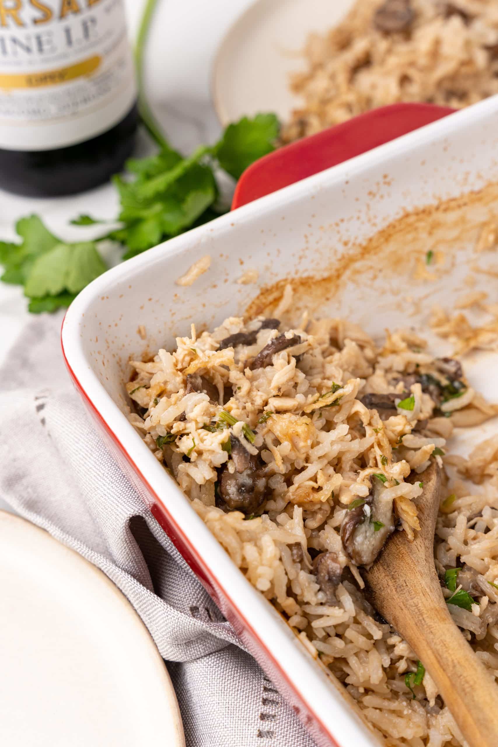 chicken marsala and rice casserole in a red baking dish