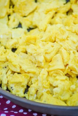 fluffy fool proof scrambled eggs in a large black skillet