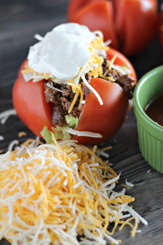 ripe tomatoes stuffed with taco seasoned ground beef and topped with lettuce cheese & sour cream