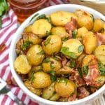honey mustard potato salad with bacon in a white bowl