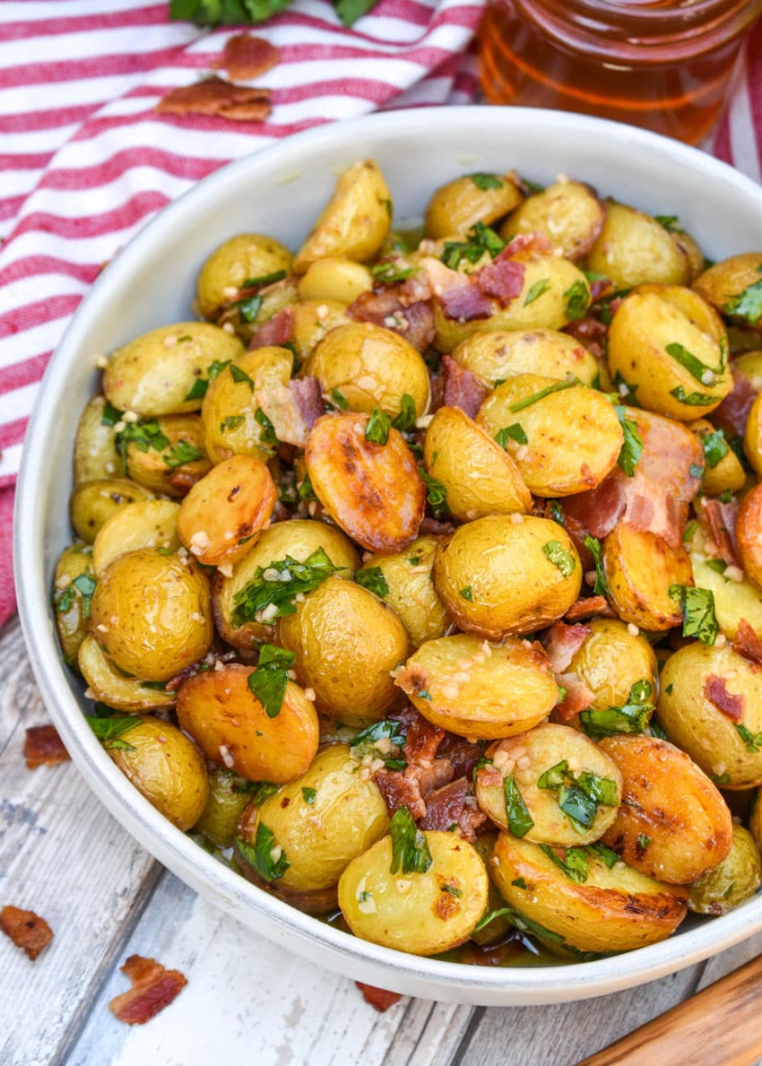 honey mustard potato salad with bacon in a white bowl