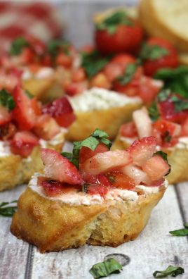 strawberry bruschetta on toasted baguette sliced spread with creamy goat cheese