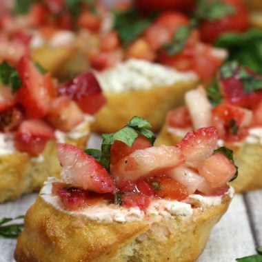 strawberry bruschetta on toasted baguette sliced spread with creamy goat cheese