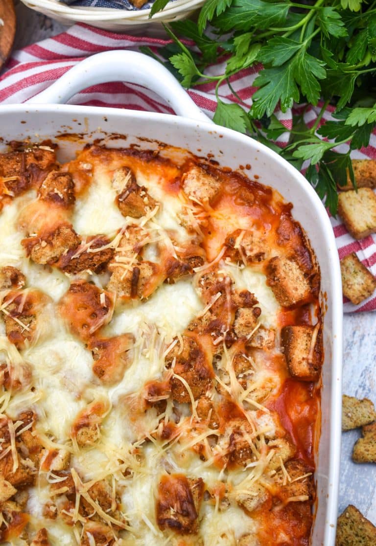 chicken parmesan casserole in a white baking dish