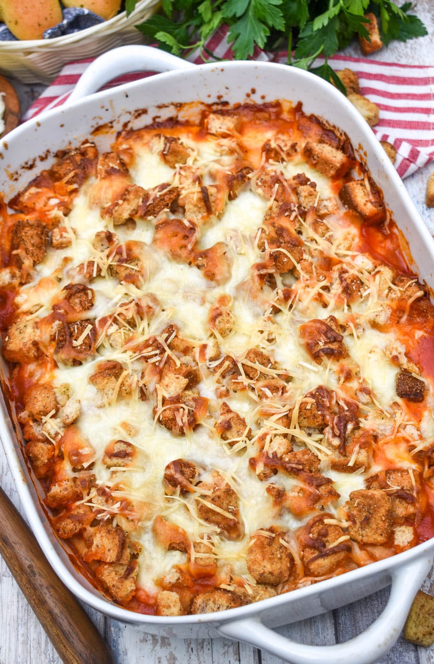 chicken parmesan casserole in a white baking dish