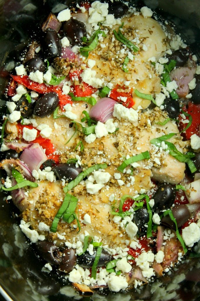 Greek chicken in the bowl of a crockpot