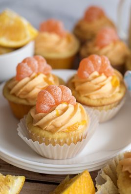 ORANGE DREAMSICLE CUPCAKES ON A WHITE PLATE