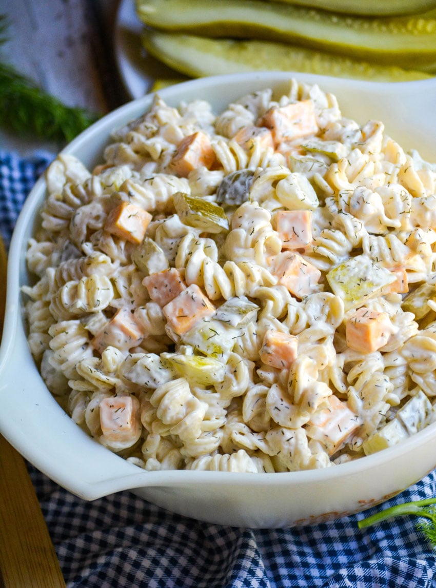 dill pickle pasta salad in a white pyrex bowl