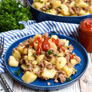 instant pot ground beef and potato hash on a blue plate