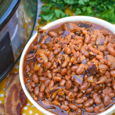 SLOW COOKER BAKED BEANS IN A WHITE BOWL